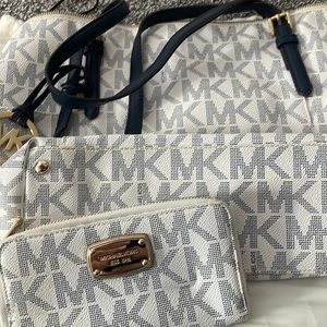 Michael Kors Blue and White Initial hang bag and matching wallet.